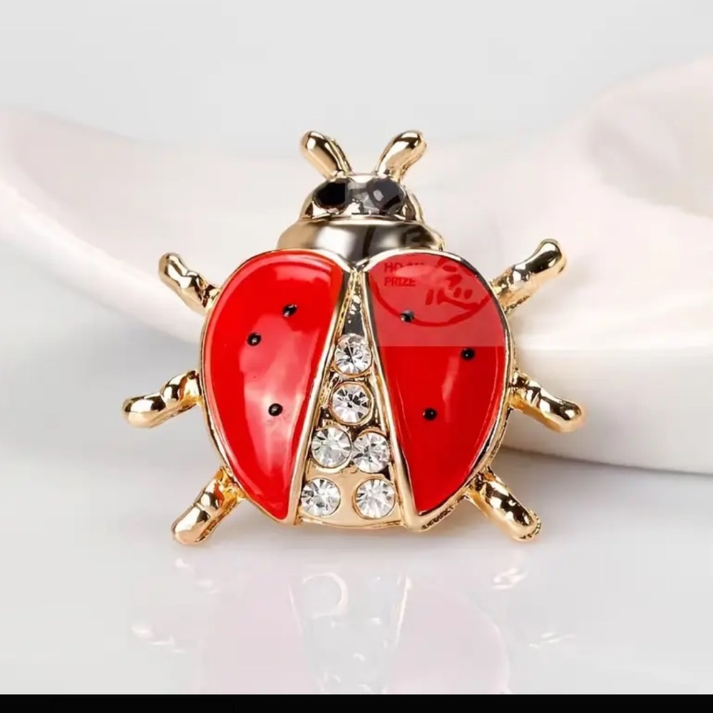 Brooch- ladybug, NIP, red enamel paint, rhinestones, golden base, approx .9x1.06